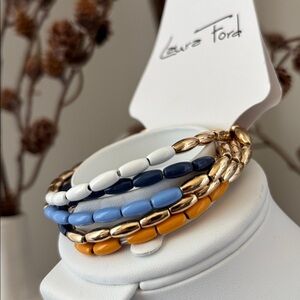 Laura Ford Goldtone 5 Row Rice bead, blues,white, mustard,chunky stretch